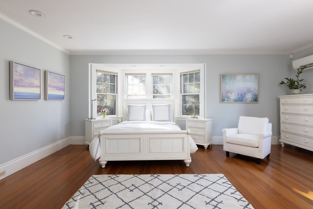 96 Crafts Road Brookline, MA 02467 - Photo 17 of 30 a spacious bedroom with a bed and a couch