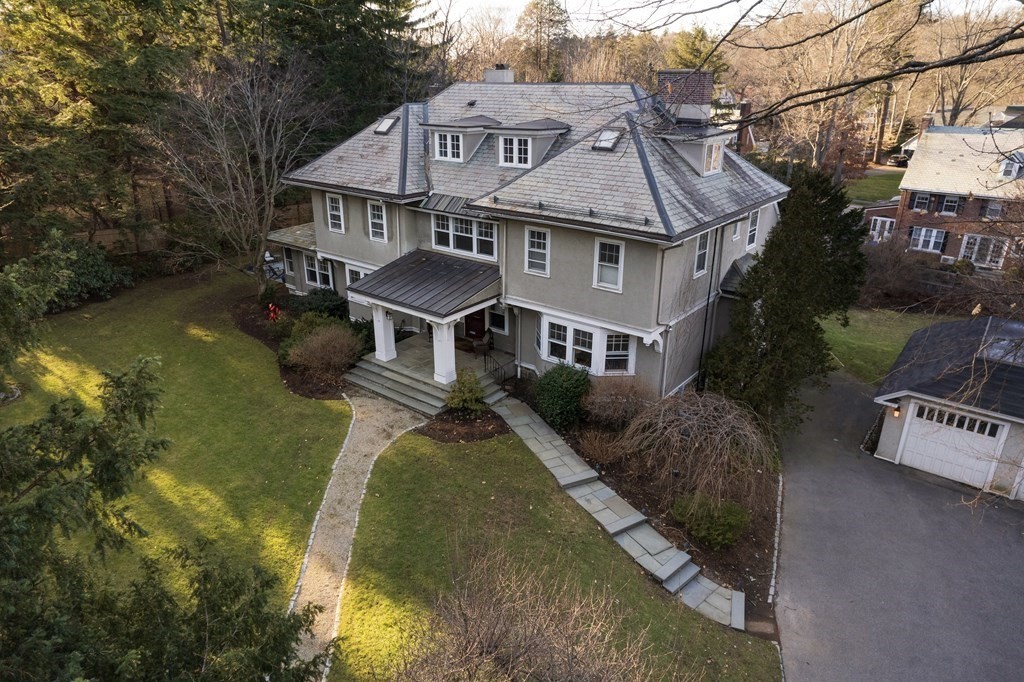 96 Crafts Road Brookline, MA 02467 - Photo 2 of 30 a aerial view of a house with swimming pool and large trees