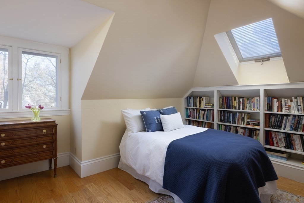 96 Crafts Road Brookline, MA 02467 - Photo 24 of 30 a bedroom with a bed and a book shelf