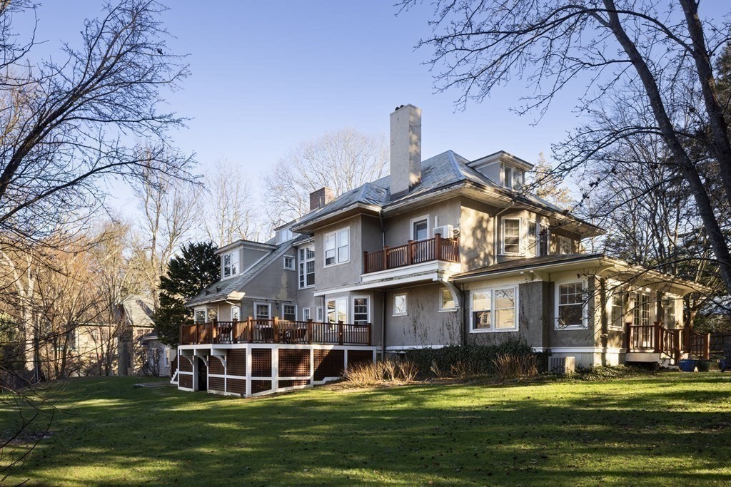 96 Crafts Road Brookline, MA 02467 - Photo 27 of 30 a view of a building with a big yard and large trees