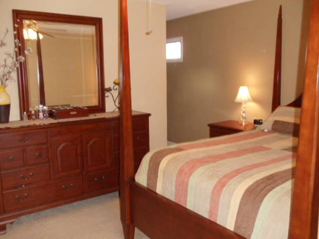 1624 Meadows Road Vinton, VA 24179 - Photo 11 of 30 a bedroom with a bed and a dresser
