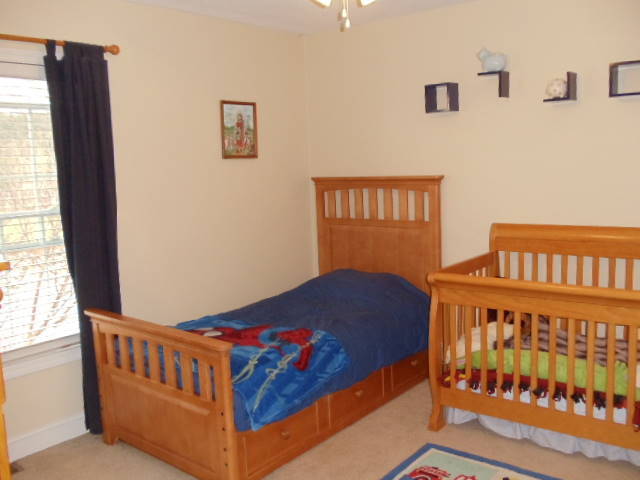 1624 Meadows Road Vinton, VA 24179 - Photo 15 of 30 a bedroom with a bed and window