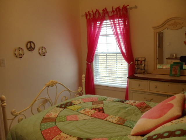 1624 Meadows Road Vinton, VA 24179 - Photo 19 of 30 a bed sitting in a bedroom next to a window