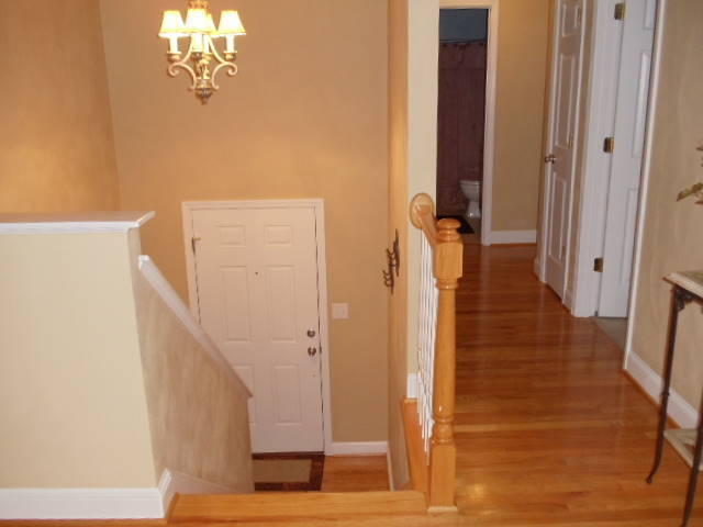 1624 Meadows Road Vinton, VA 24179 - Photo 3 of 30 a view of a hallway with wooden floor and staircase