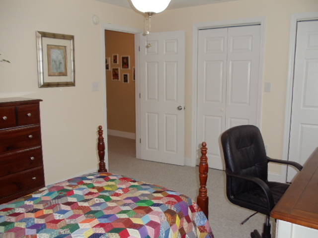 1624 Meadows Road Vinton, VA 24179 - Photo 25 of 30 a bedroom with a bed and a chair