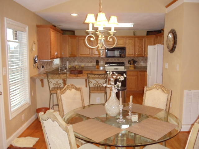 1624 Meadows Road Vinton, VA 24179 - Photo 6 of 30 a view of a dining room with furniture and chandelier