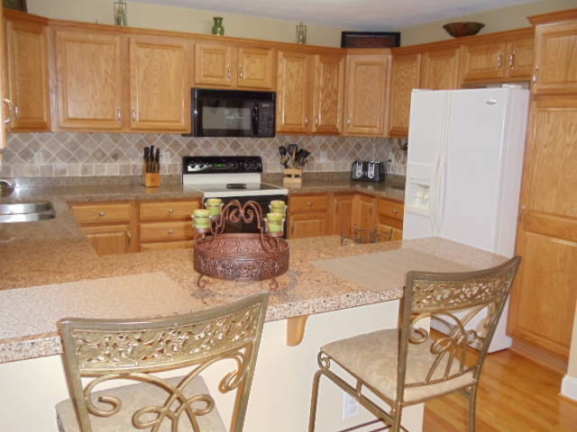 1624 Meadows Road Vinton, VA 24179 - Photo 7 of 30 a kitchen with stainless steel appliances granite countertop a refrigerator a stove top oven a sink and dishwasher