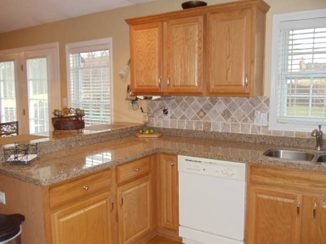 1624 Meadows Road Vinton, VA 24179 - Photo 9 of 30 a kitchen with granite countertop cabinets sink and window