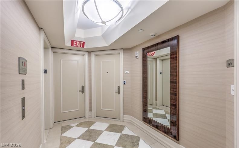 2777 Paradise Road, Unit 807 Las Vegas, NV 89109 - Photo 3 of 61 A well-appointed hallway with checkered flooring and a full-length mirror offers a grand entrance.