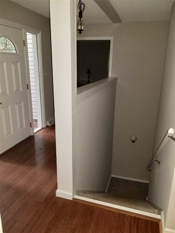 6420 Rockrest Court Raleigh, NC 27612 - Photo 2 of 22 Entry foyer and basement access