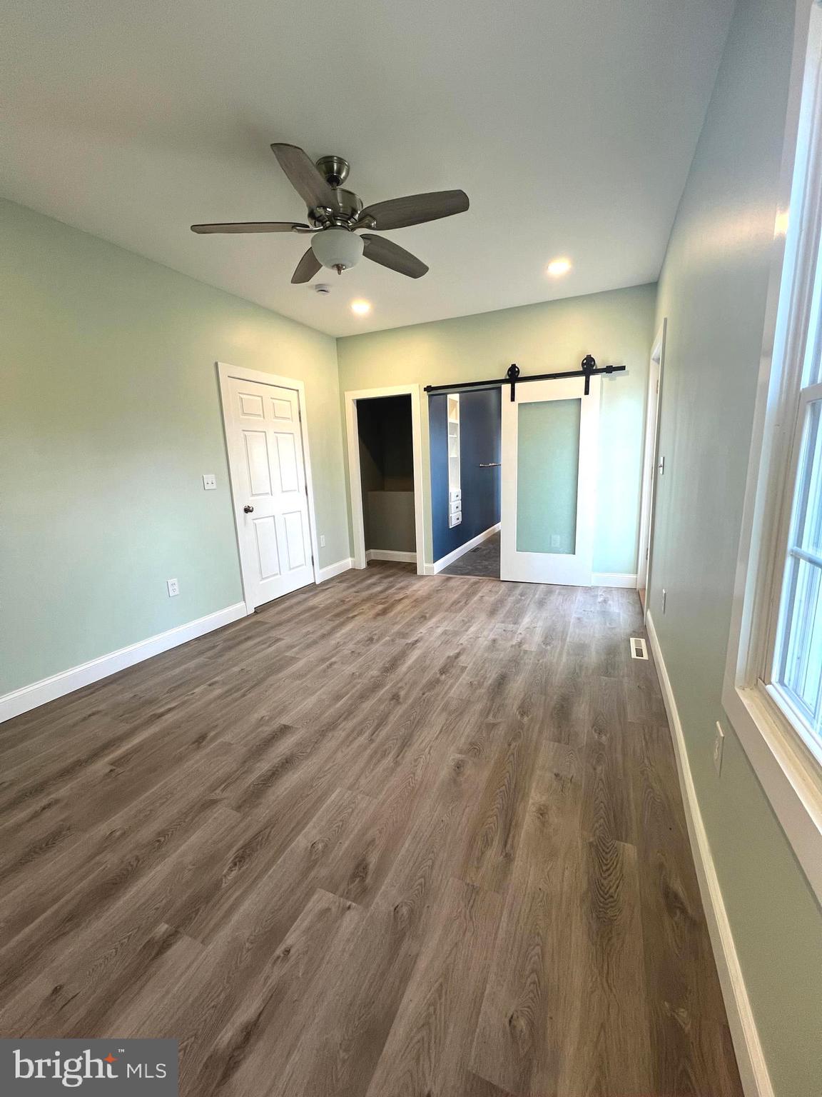 7617 Old Plank Road Fredericksburg, VA 22407 - Photo 23 of 61 wooden floor in an empty room with a window