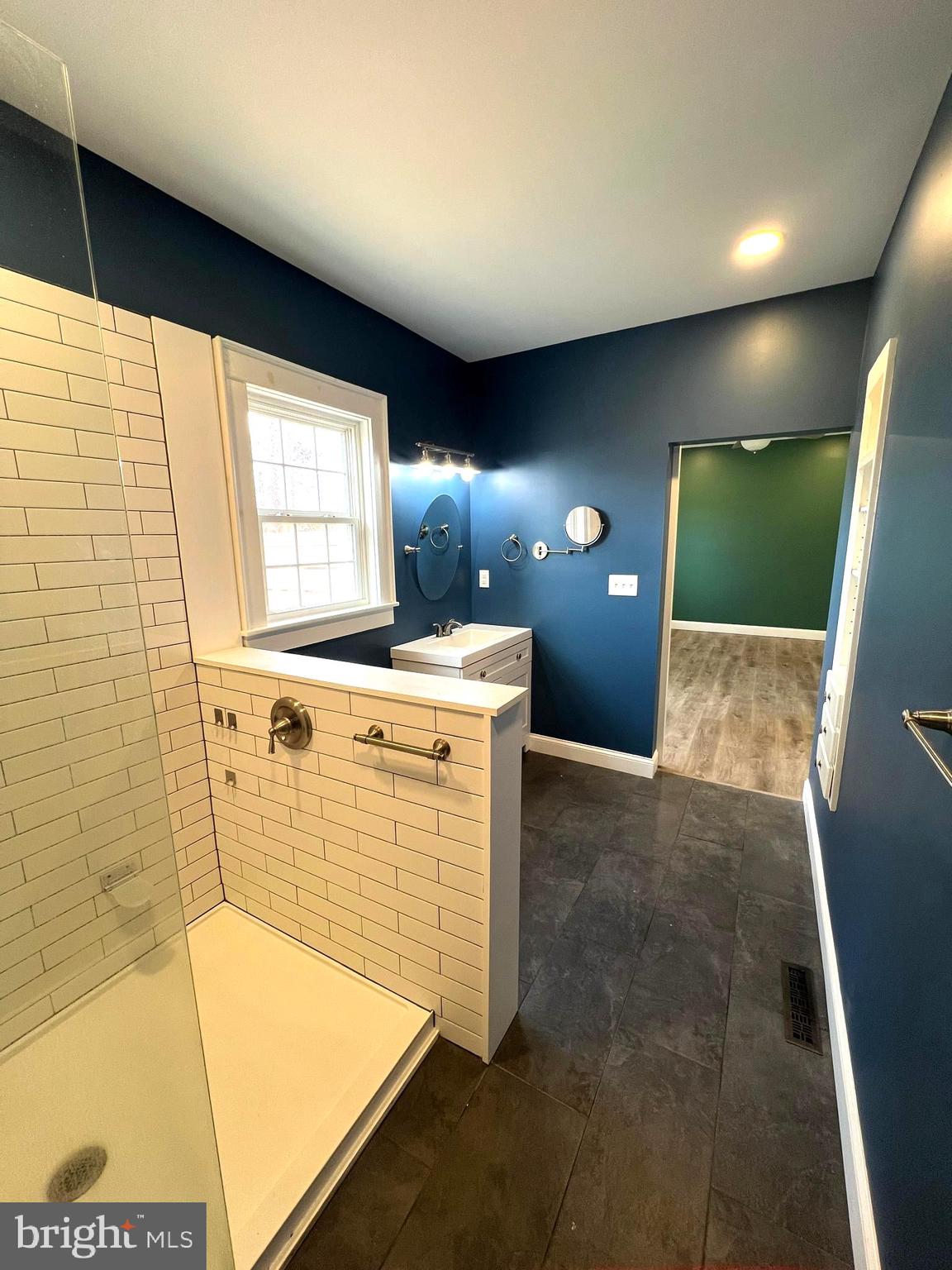 7617 Old Plank Road Fredericksburg, VA 22407 - Photo 27 of 61 a bathroom with a tub and a shower
