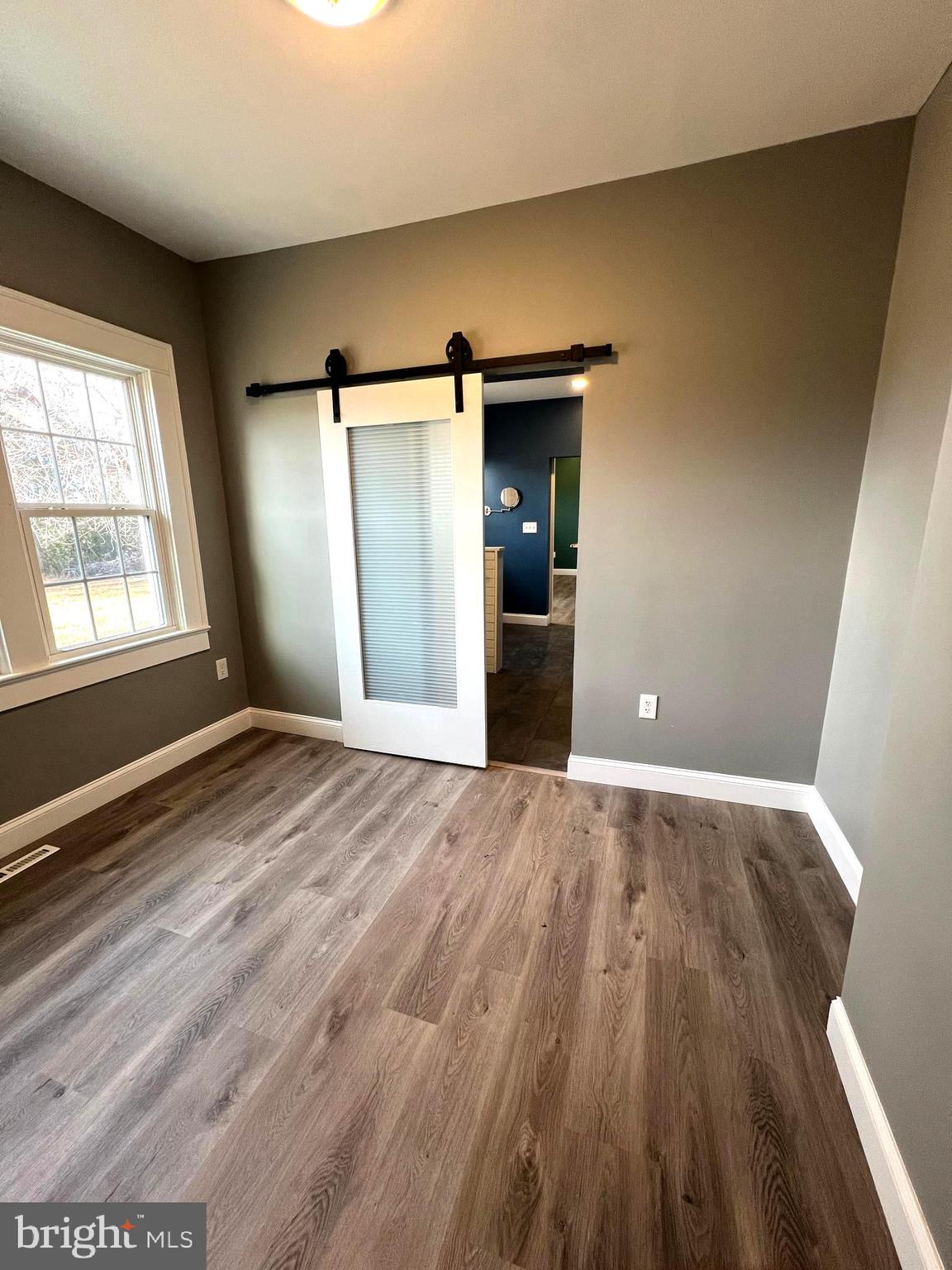 7617 Old Plank Road Fredericksburg, VA 22407 - Photo 29 of 61 a view of empty room with wooden floor and fan