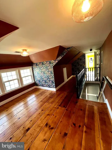 a view of a living room with a wooden floor