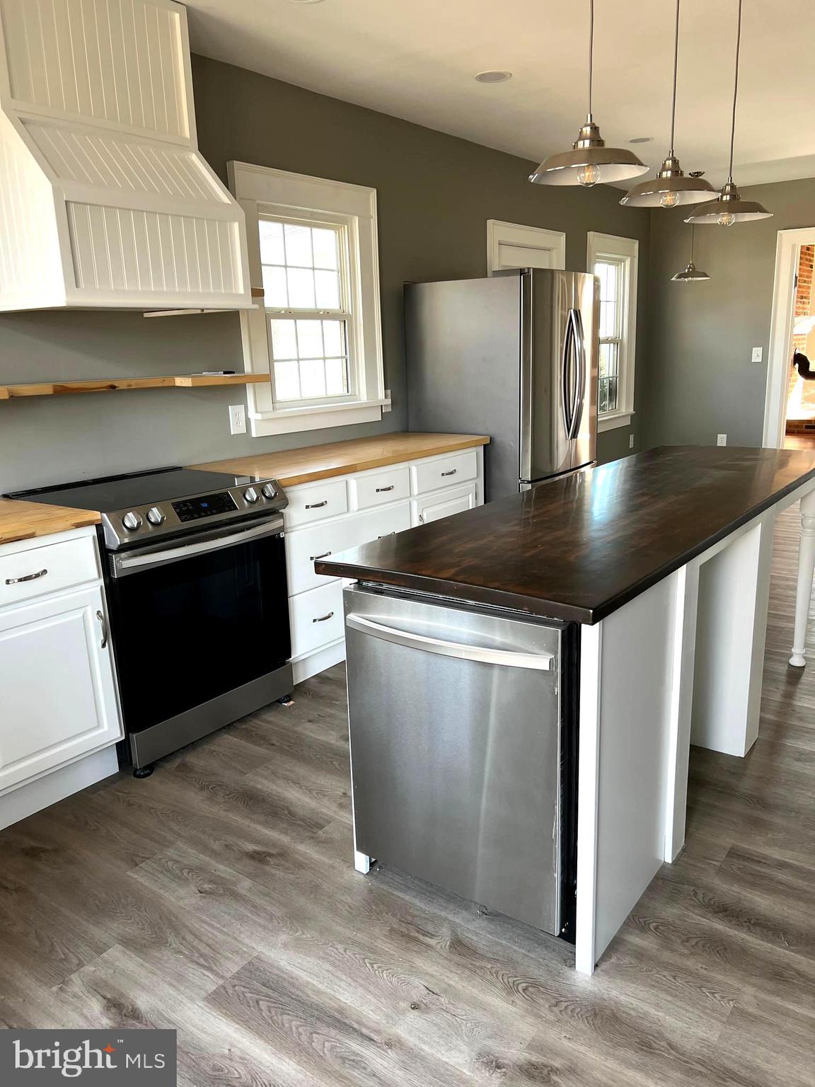 7617 Old Plank Road Fredericksburg, VA 22407 - Photo 4 of 61 a kitchen with stainless steel appliances granite countertop a stove a sink and a refrigerator