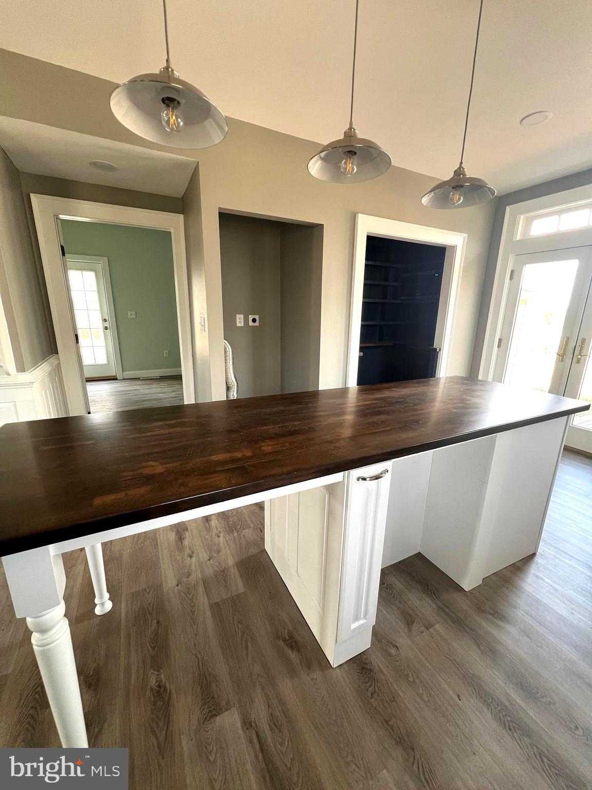 7617 Old Plank Road Fredericksburg, VA 22407 - Photo 5 of 61 a view of an empty room with wooden floor and a window
