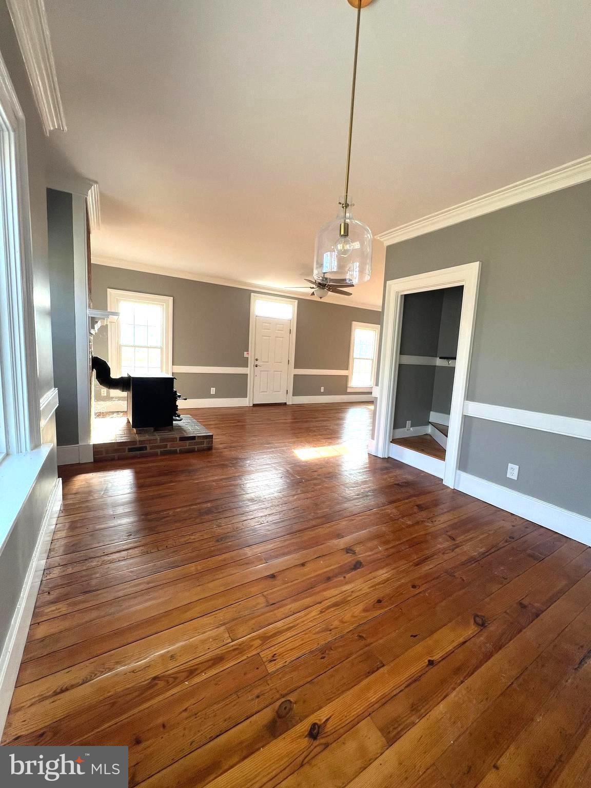 7617 Old Plank Road Fredericksburg, VA 22407 - Photo 51 of 61 a view of a room with wooden floor staircase and a kitchen