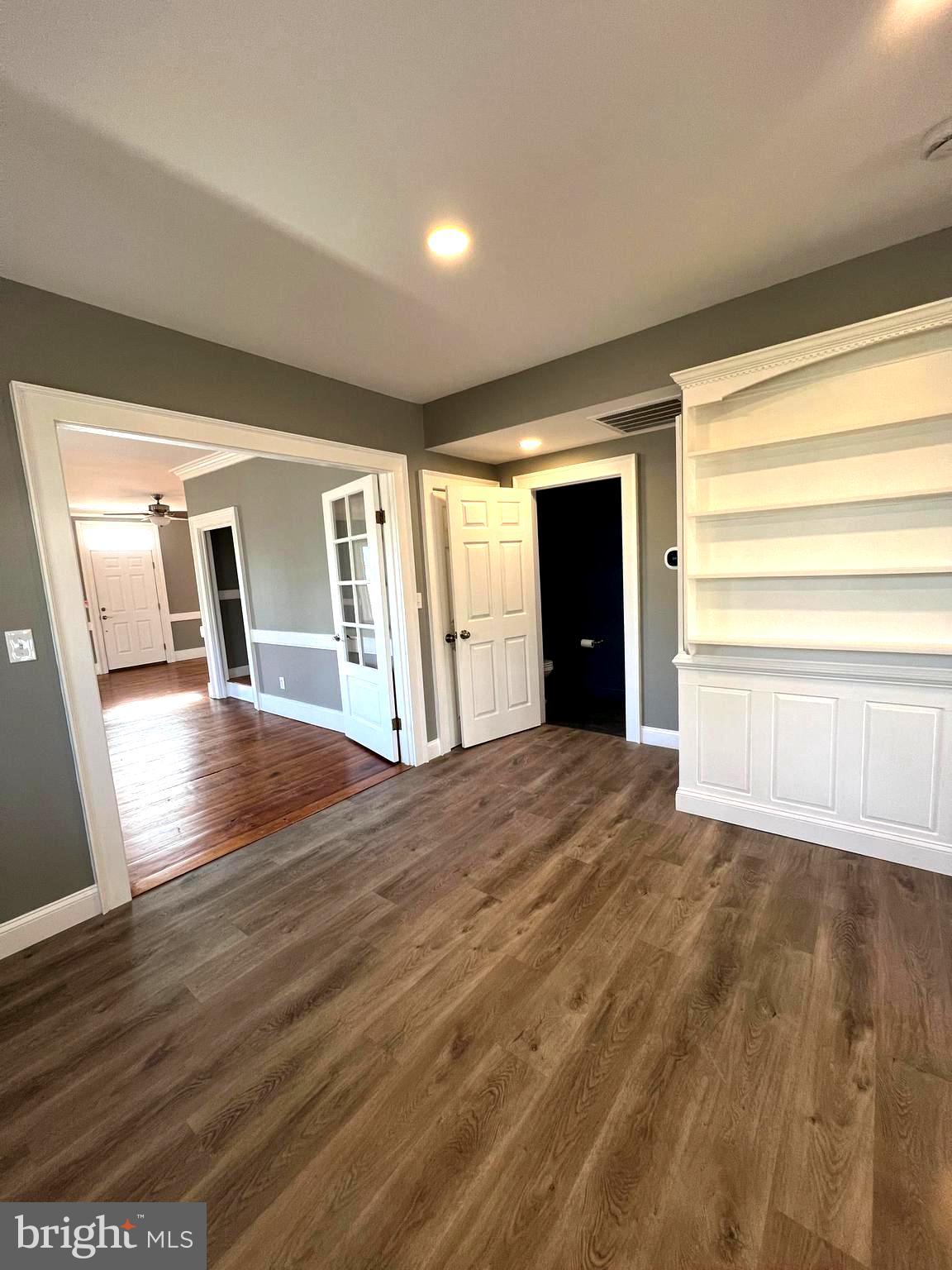 7617 Old Plank Road Fredericksburg, VA 22407 - Photo 10 of 61 a view of empty room with wooden floor and fan