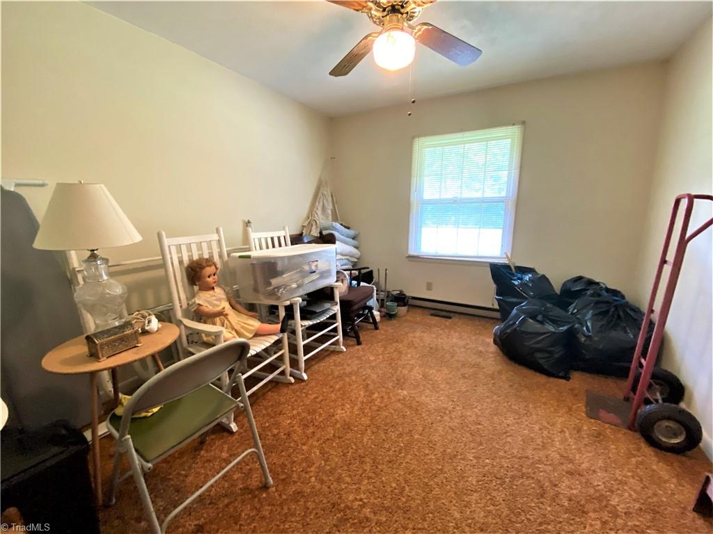6603 Company Mill Road Climax, NC 27233 - Photo 13 of 24 The third bedroom is currently being used as storage of some final items that will be removed before closing the sale.