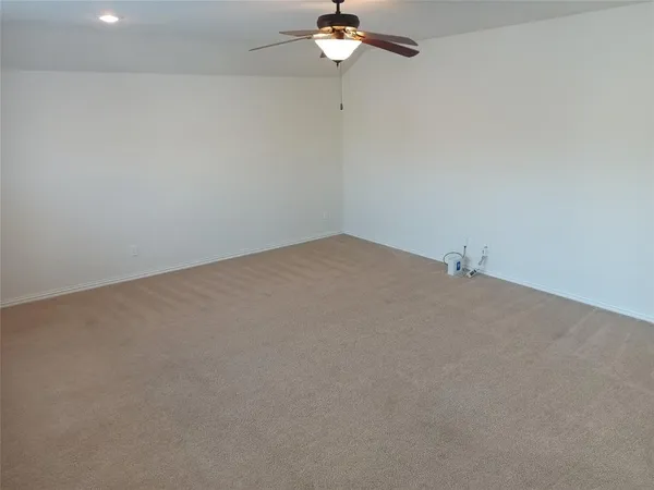 a view of a room with a fan
