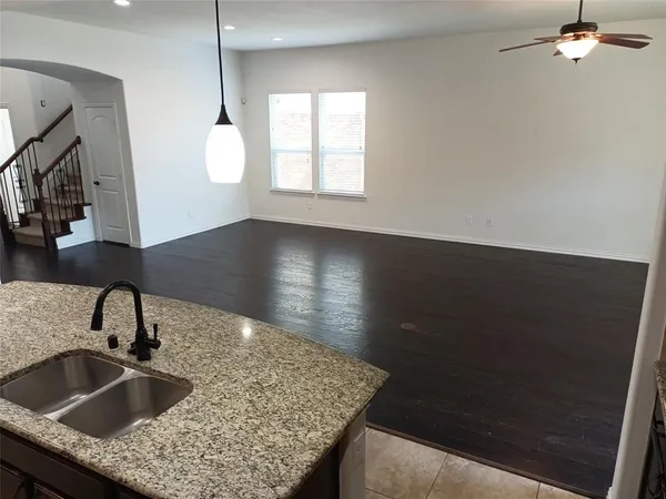 a kitchen with a sink a granite counter top and a granite top