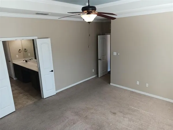 a view of a chandelier fan and a refrigerator in a room