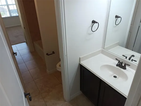 a bathroom with a sink a mirror and shower