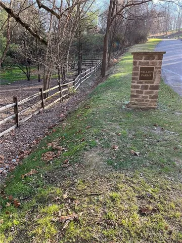 a view of outdoor space with deck and yard