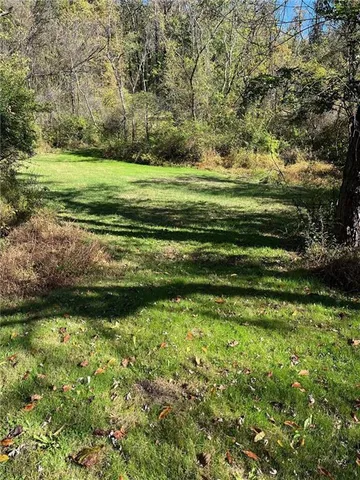 a view of a golf course with a lake