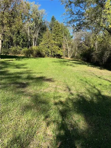 a view of a field with an trees