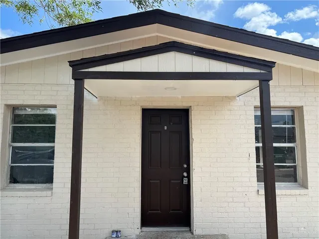 a front view of a house with garage