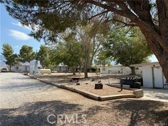 a view of a house with snow on the road