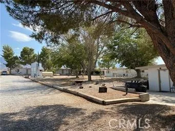 a view of a house with snow on the road