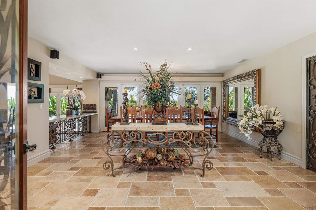 16346 Via Del Alba Rancho Santa Fe, CA 92067 - Photo 3 of 34 a view of a dining room with furniture and a chandelier