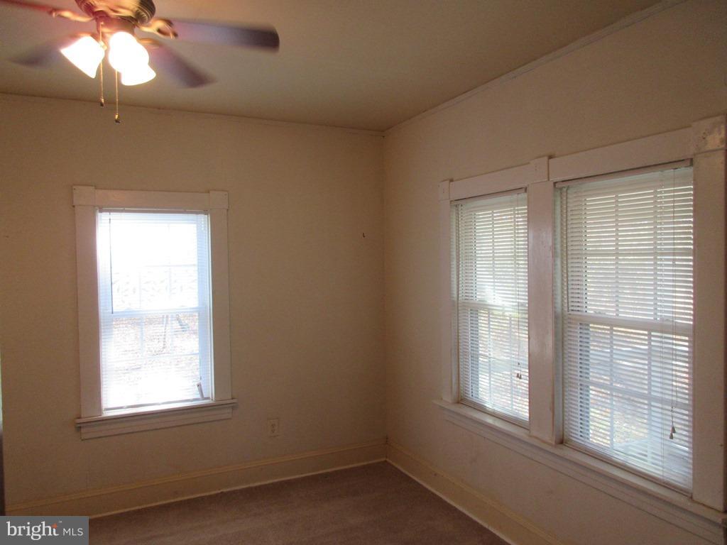 24790 Colton Point Road Clements, MD 20624 - Photo 11 of 16 an empty room with a window