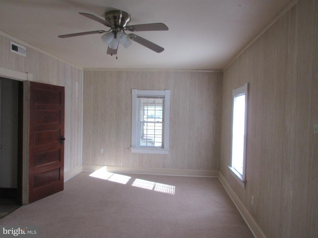 24790 Colton Point Road Clements, MD 20624 - Photo 12 of 16 a view of empty room with window and ceiling fan