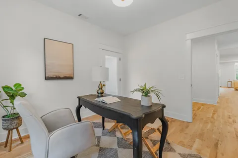 an empty room with windows and closet