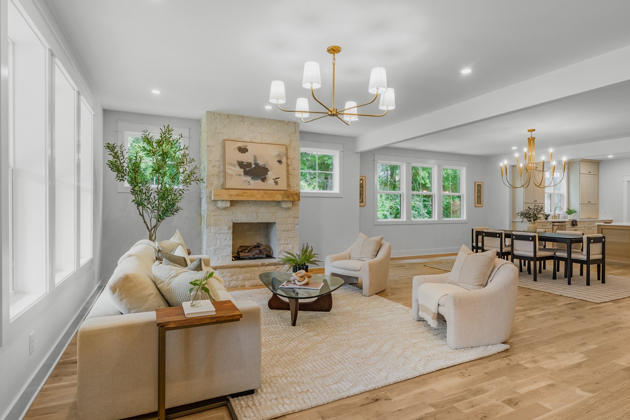 1629 Cairo Road Gallatin, TN 37066 - Photo 5 of 61 a living room with furniture a chandelier and a fireplace