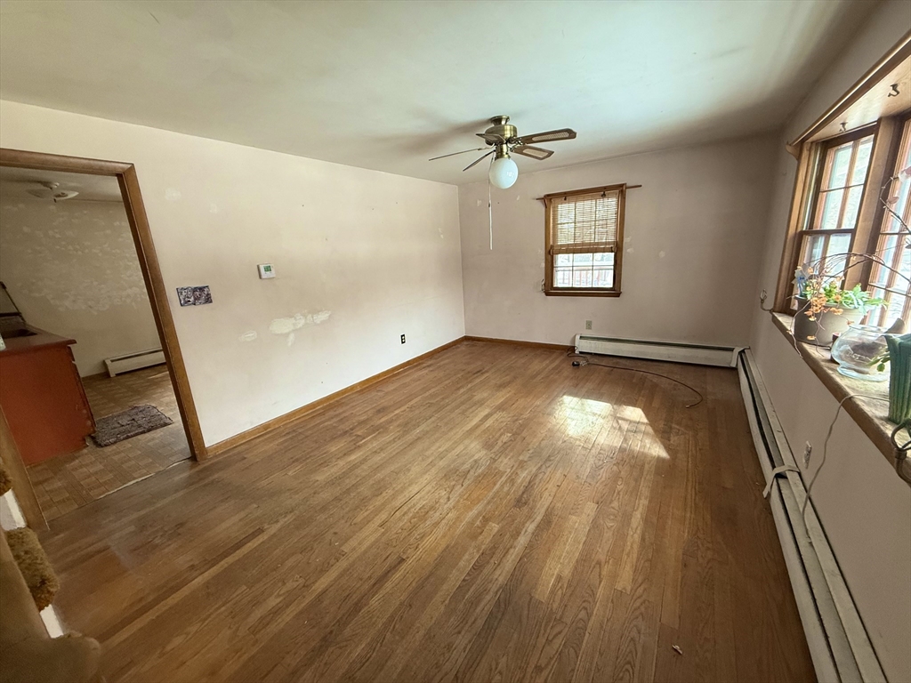 58 Arnold Road Sturbridge, MA 01518 - Photo 7 of 25 wooden floor in an empty room with a window