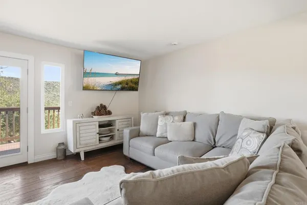 a living room with furniture and a large window