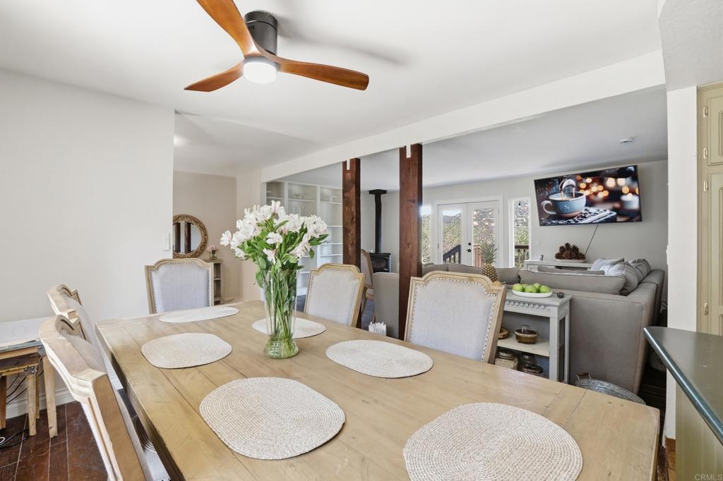 3340 Skytrail Ranch Road Jamul, CA 91935 - Photo 23 of 42 a dining room with furniture and a potted plant
