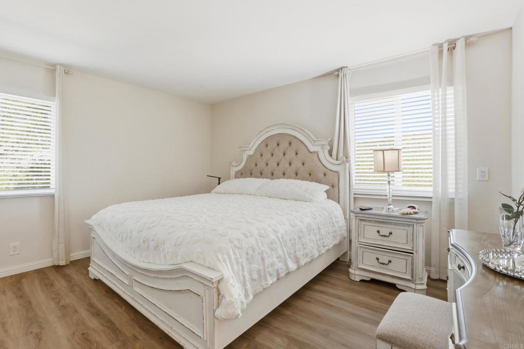 3340 Skytrail Ranch Road Jamul, CA 91935 - Photo 25 of 42 a large bed sitting in a bedroom next to a window