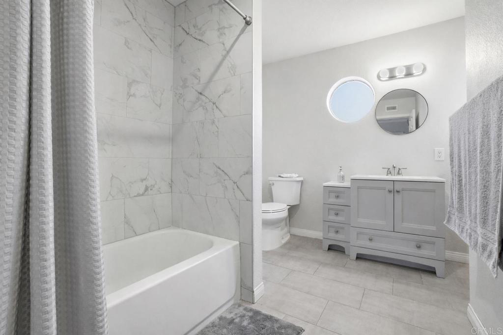 3340 Skytrail Ranch Road Jamul, CA 91935 - Photo 28 of 42 a bathroom with a sink a toilet and bathtub