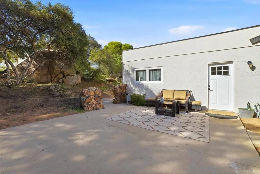 3340 Skytrail Ranch Road Jamul, CA 91935 - Photo 32 of 42 a view of a backyard with a sitting area