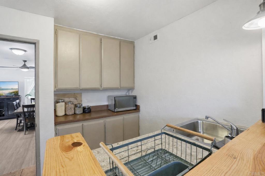3340 Skytrail Ranch Road Jamul, CA 91935 - Photo 37 of 42 a kitchen with a sink and cabinets