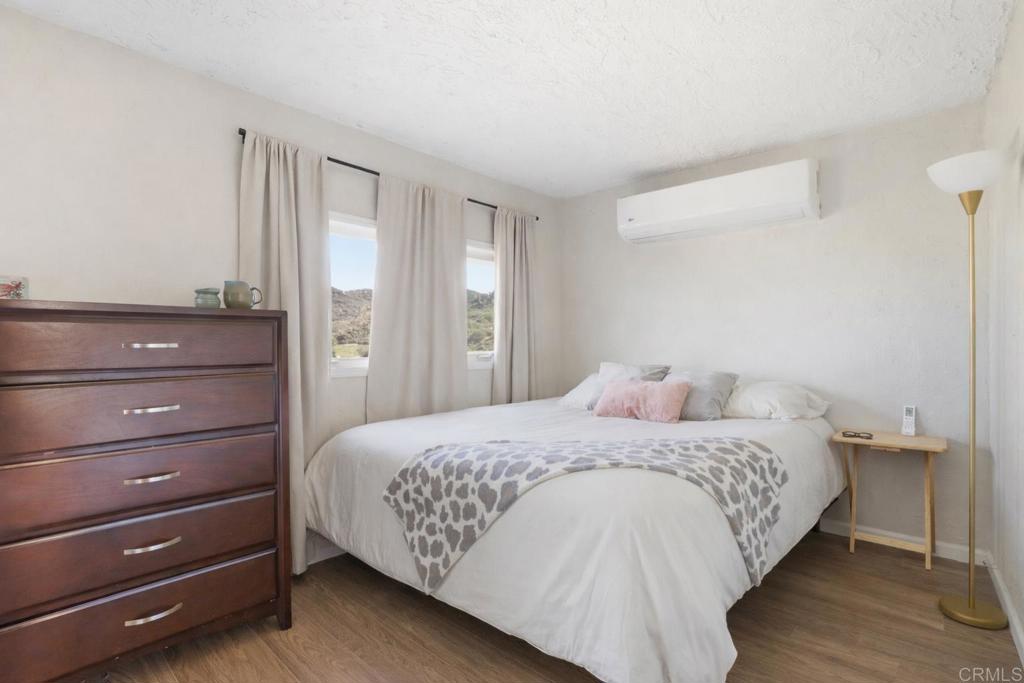 3340 Skytrail Ranch Road Jamul, CA 91935 - Photo 40 of 42 a bedroom with a bed and a window