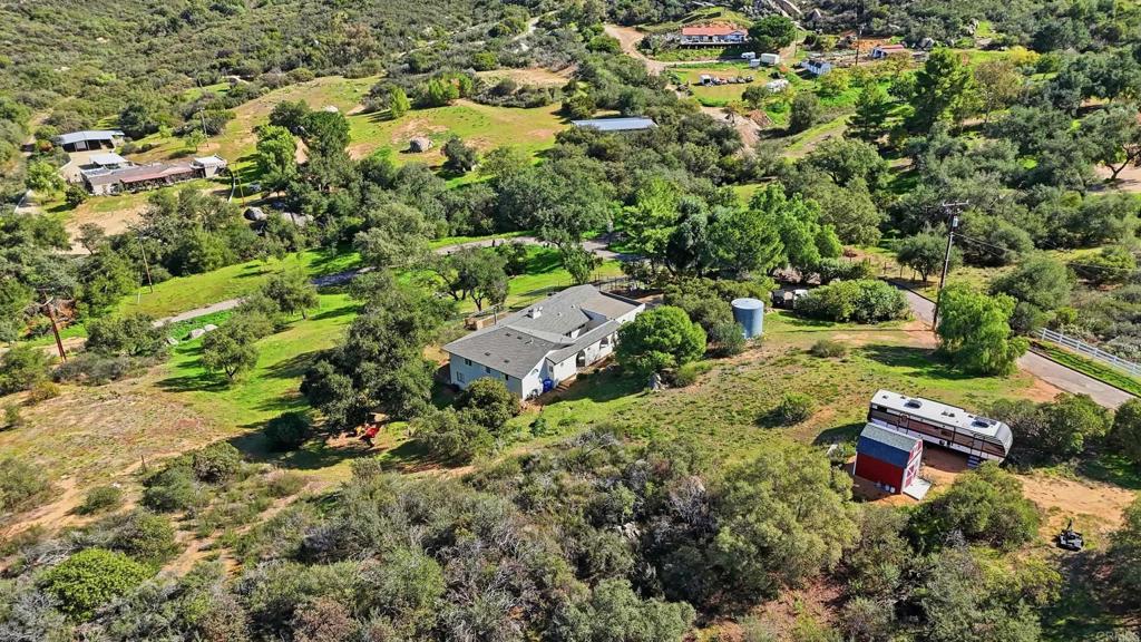 3340 Skytrail Ranch Road Jamul, CA 91935 - Photo 4 of 42 an aerial view of residential house with outdoor space and trees all around