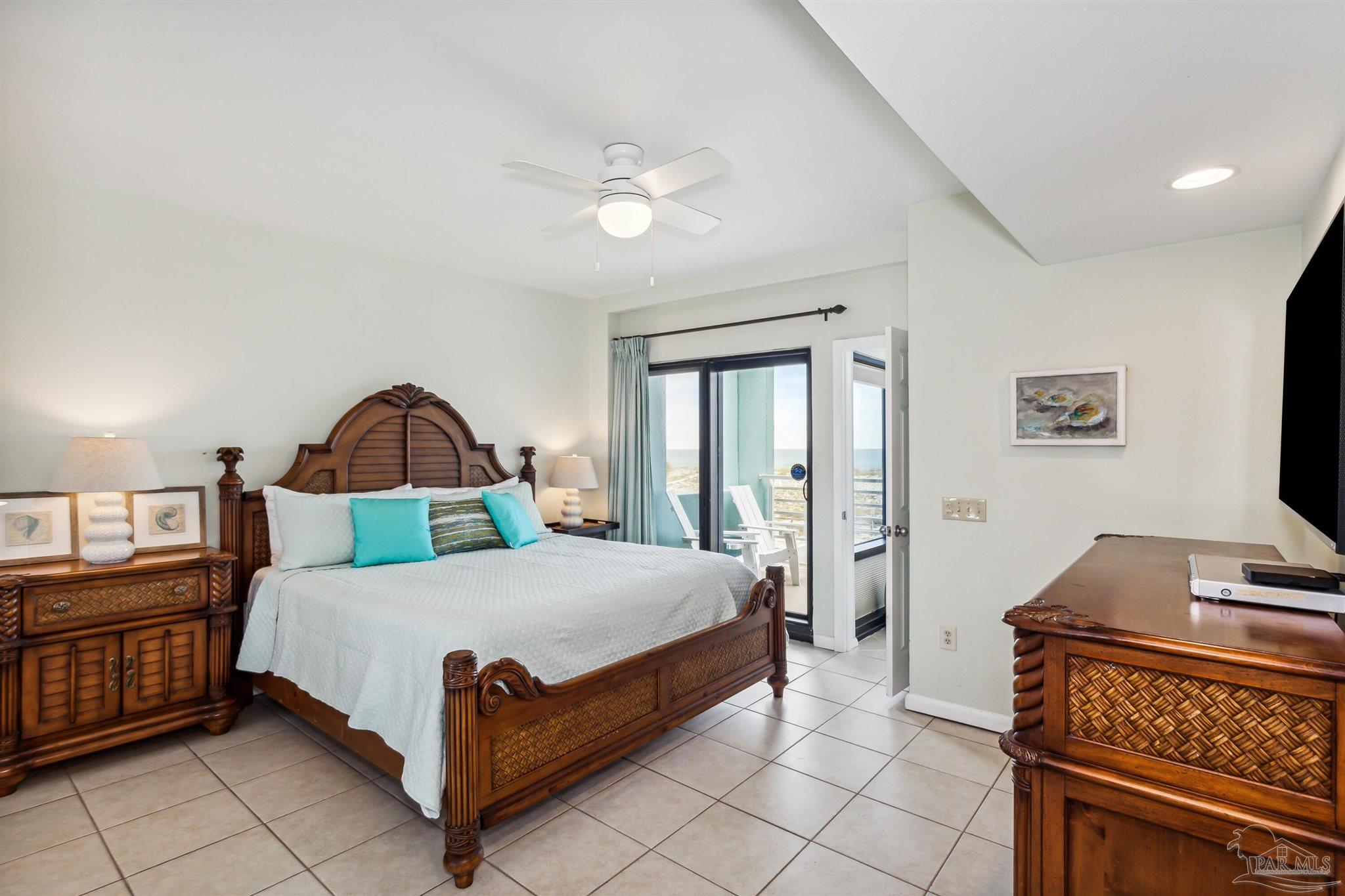 1390 Fort Pickens Road, Unit 229 Pensacola Beach, FL 32561 - Photo 20 of 47 a bedroom with a bed and a flat tv screen on dresser