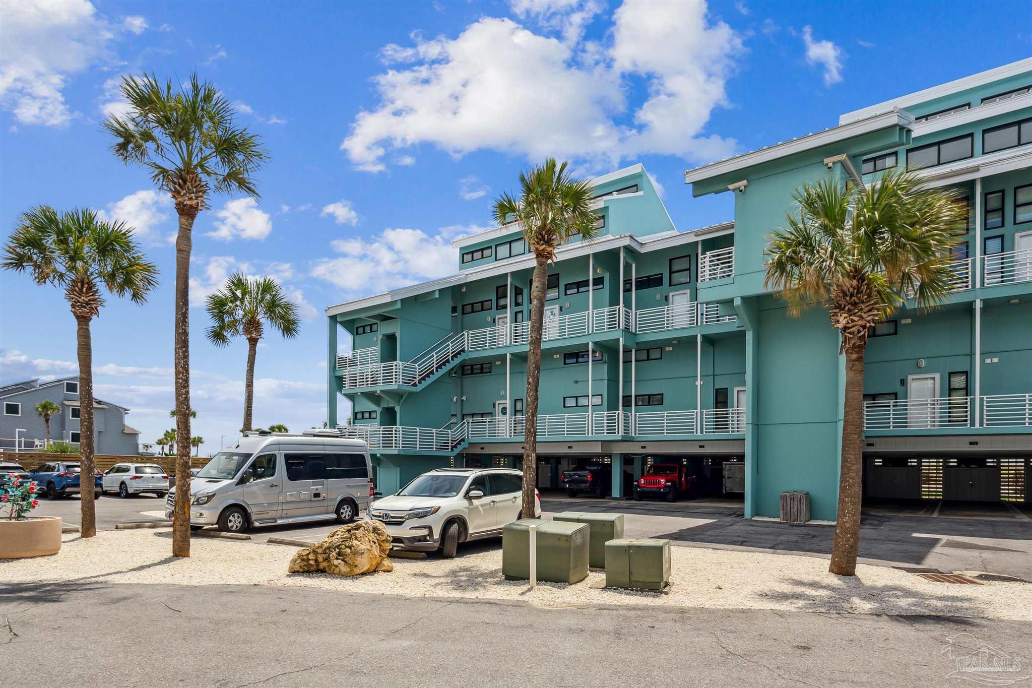 1390 Fort Pickens Road, Unit 229 Pensacola Beach, FL 32561 - Photo 32 of 47 a car parked in front of a building