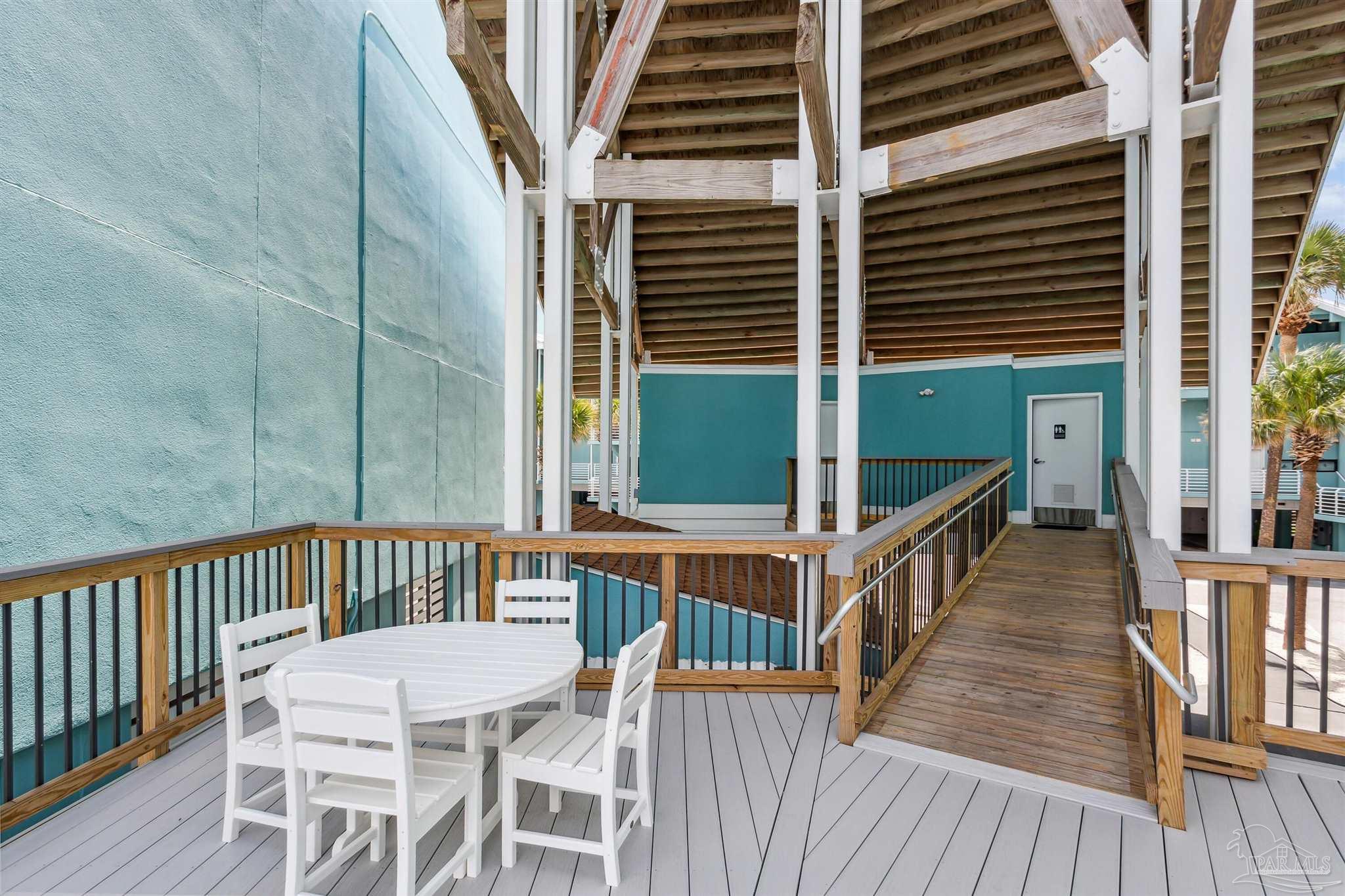 1390 Fort Pickens Road, Unit 229 Pensacola Beach, FL 32561 - Photo 37 of 47 a view of a balcony with chairs